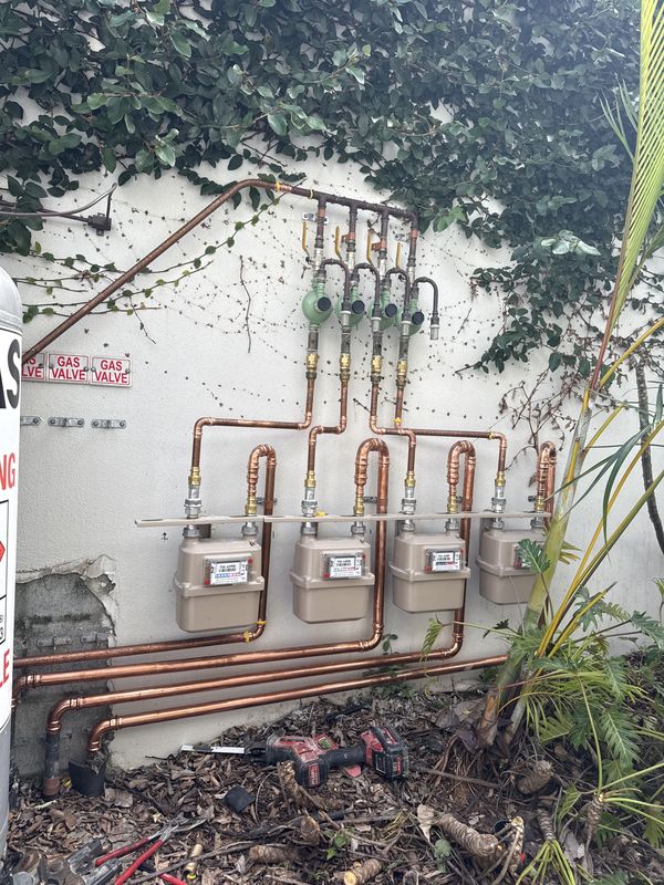 Copper multi-meter gas manifold on an external wall